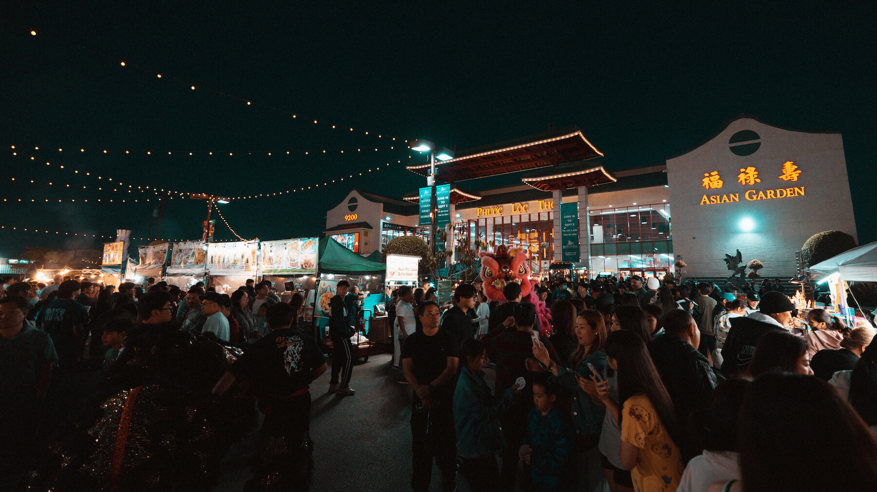 Night crowds attending the Asian Garden Night Market